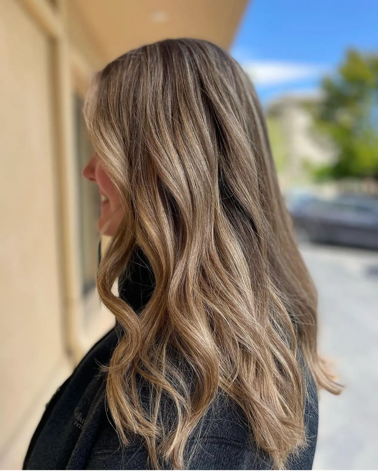 Long brunette balayage with cool blonde ribbons