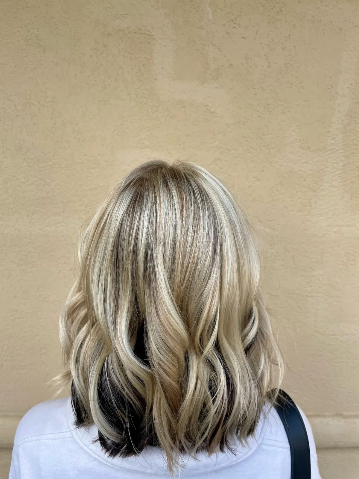 Blonde bob with a darker root and dimensional lowlights