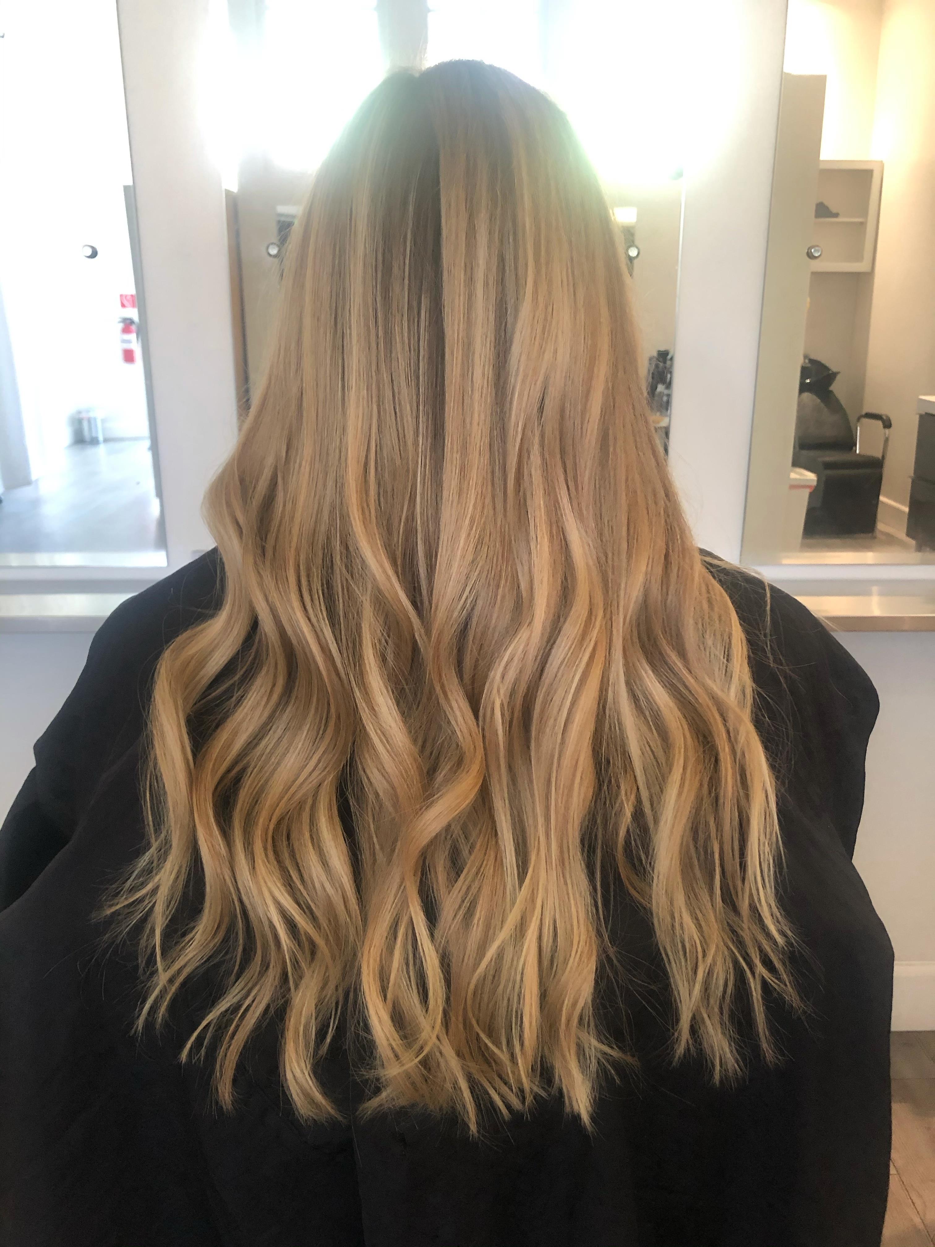 Soft blonde waves with a blended shadow root