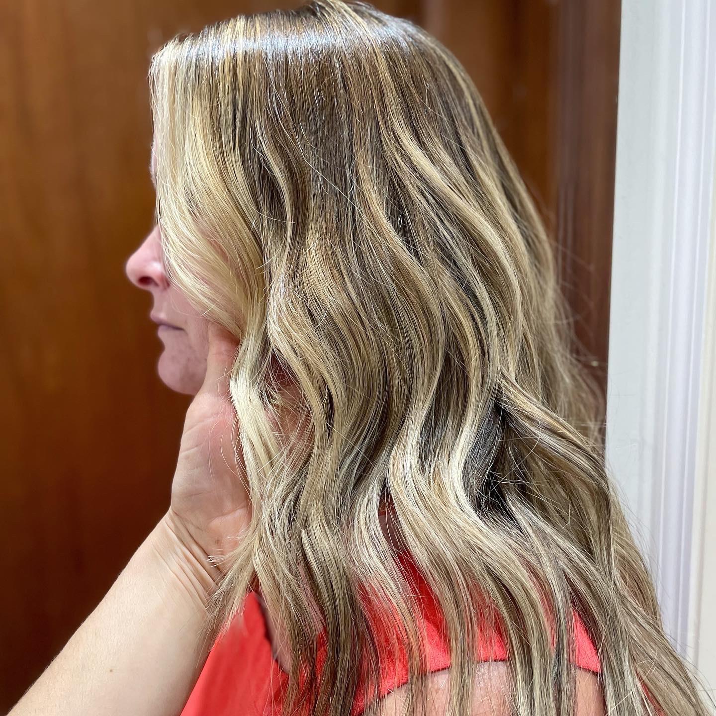 Dimensional blonde highlights styled in loose waves