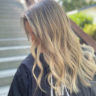 Soft blended blonde balayage with a subtle root shadow